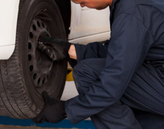 Mechanic conducting a tire rotation