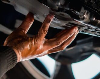 Mechanic conducting a Transmission Fluid Change