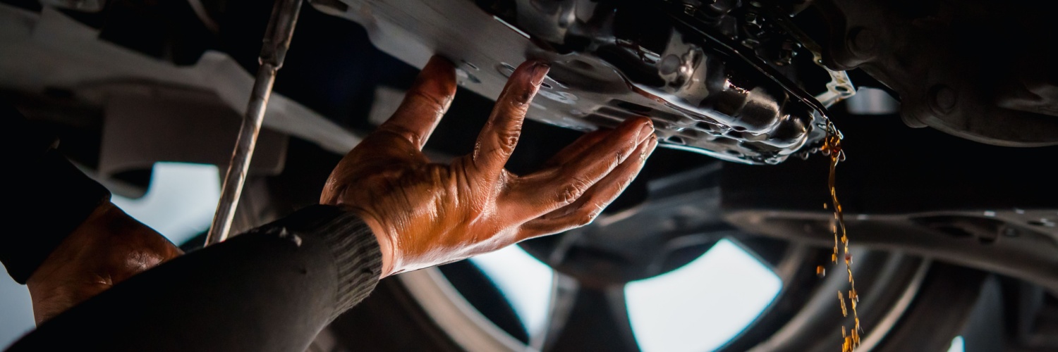 Mechanic conducting a Transmission Fluid Change