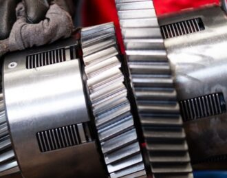 Mechanic conducting Car transmission service and repair.