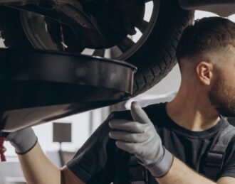 mechanic doing an oil change at Auto Service Shops Near Me